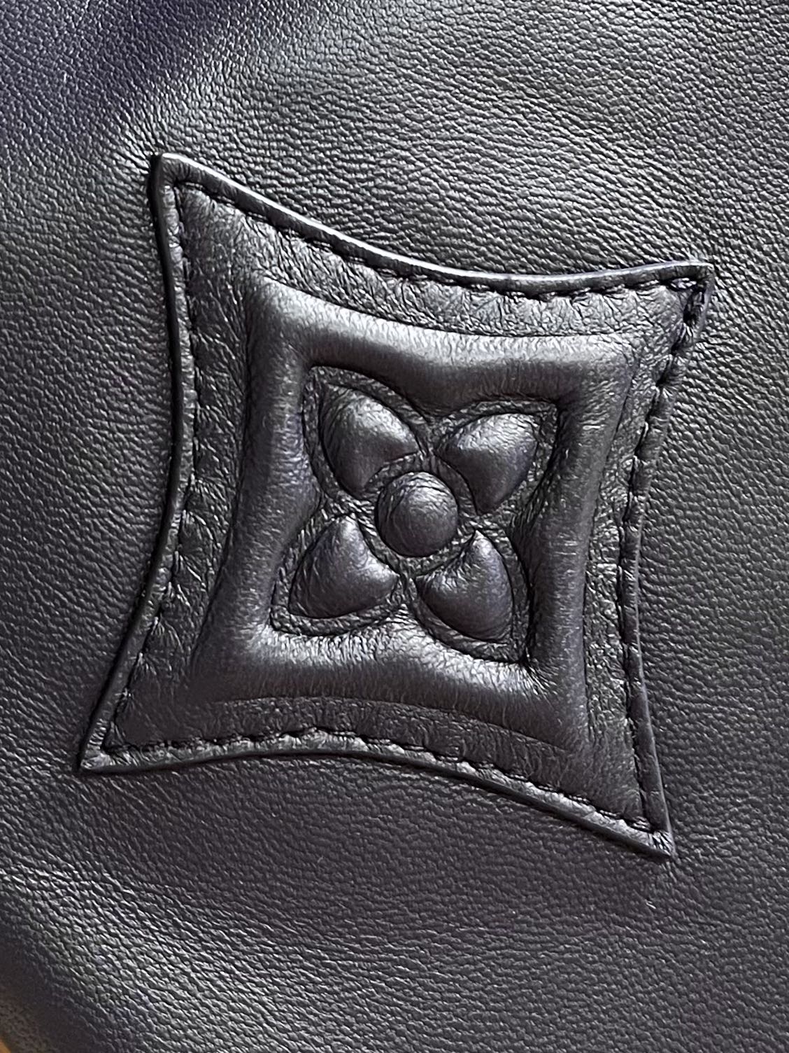 Lv 3D detail leather belted jacket